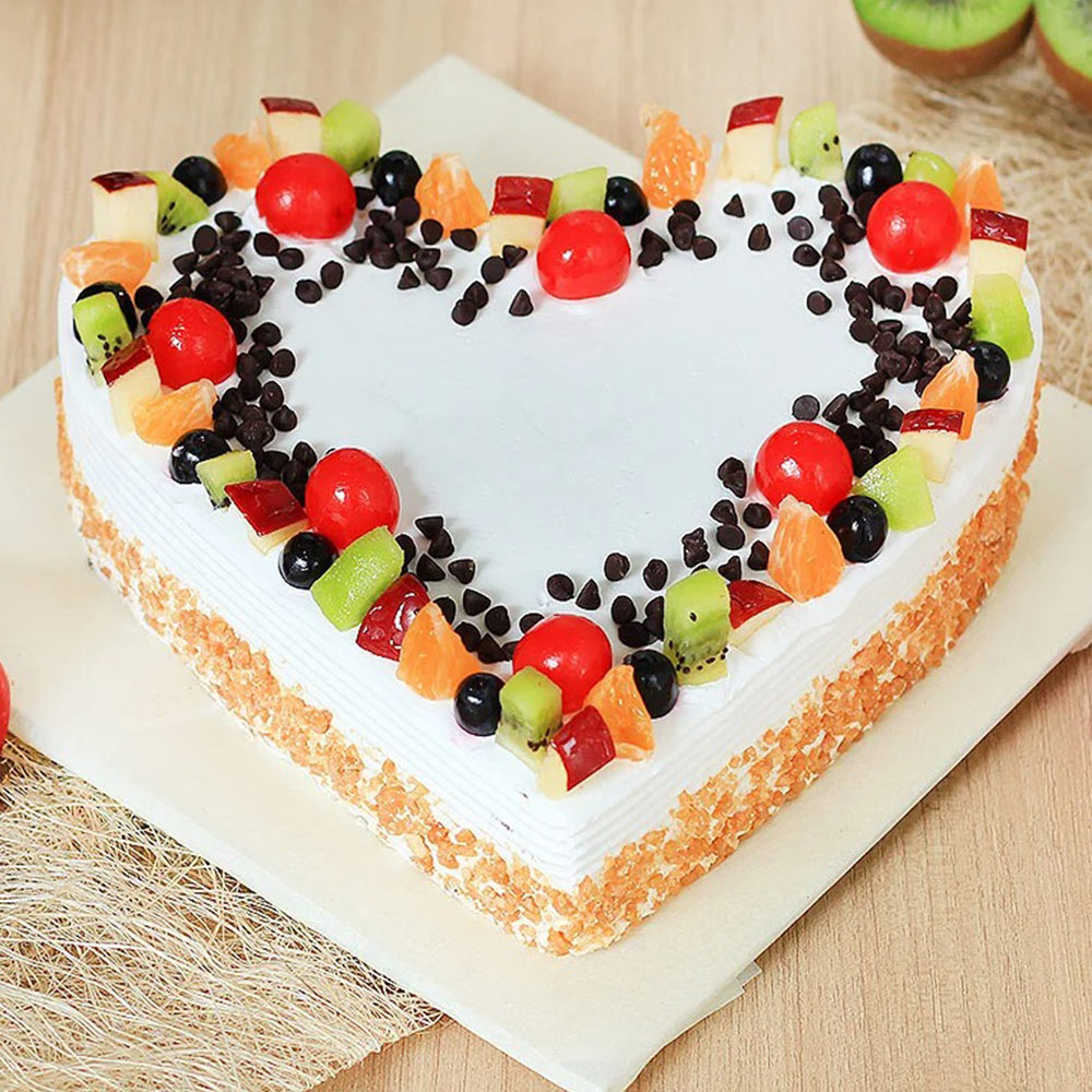 Delicious Heart Shaped Fruit Cake With Choco Chips Toppings